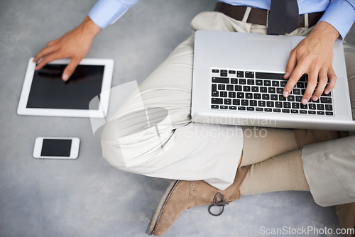 Image of Laptop, tablet and hands of man with technology, phone and mobile tech for online research, internet search or business. Typing project, UI screen or top view of professional person sitting on floor