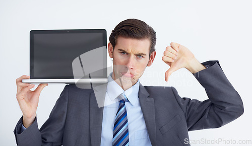 Image of Fail, thumbs down and laptop by business man portrait in studio unhappy, bad and disappointed on white background. Face, frown and negative review emoji by male person with online feedback or vote