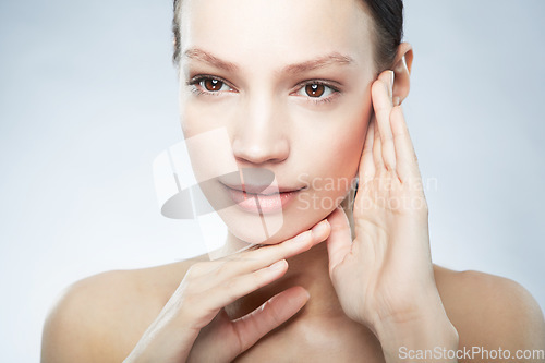 Image of Skincare, beauty and woman with hands on face isolated on studio background with mockup space. Dermatology, cosmetics and skin care model with facial makeup and luxury spa treatment for healthy glow.