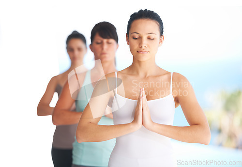 Image of Prayer hands, meditation and woman with yoga exercise outdoor with zen and pilates instructor. Spiritual, namaste and wellness of training, workout and peace from fitness friends group feeling calm