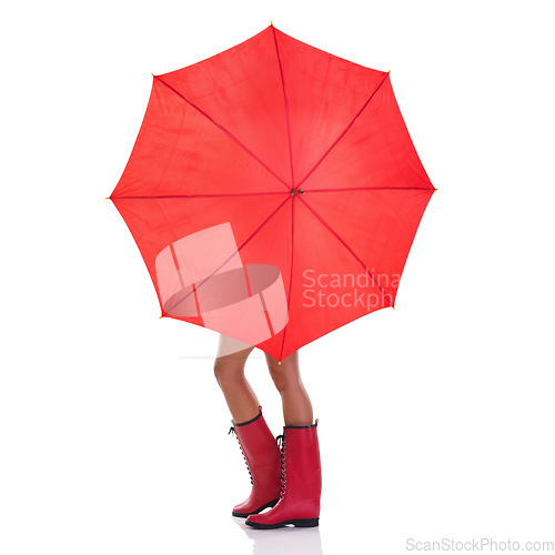 Image of Cover, weather and woman holding a red umbrella, wearing gumboots and girl isolated against a white studio background. Female person, lady and model with insurance, protection and winter outfit