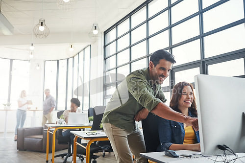 Image of Mentorship, man and woman in coworking space with smile and advice at creative start up agency. Computer, desk and happy team leader coaching for designer internship in office with help and opinion.