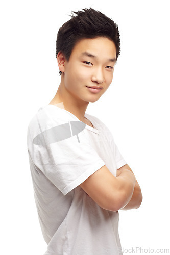 Image of Young asian man, portrait and arms crossed with smile, confidence and happiness by white background. Isolated japanese model, guy and happy with t-shirt, clothes or gen z aesthetic by studio backdrop