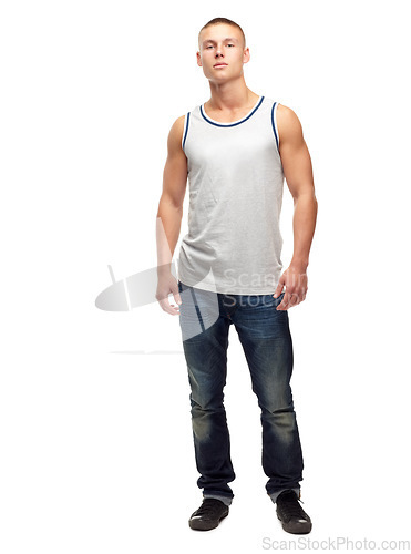 Image of Man, confident and portrait with fashion and modern style in a studio. White background, jeans and young male model with muscles and clothing with youth and attitude feeling proud with confidence