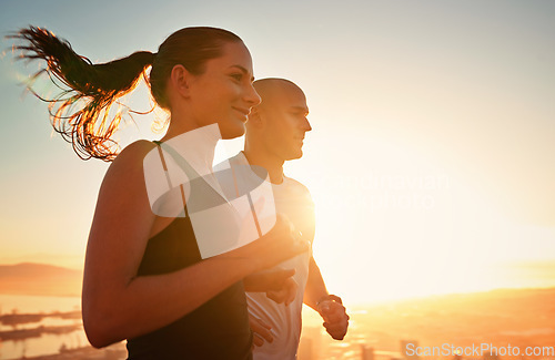 Image of Sunrise, fitness and happy couple running as workout or morning exercise for health and wellness together. Sport, man and woman runner run with athlete as training in a city for sports with energy