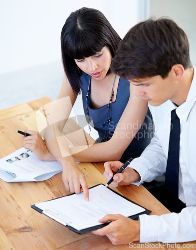 Image of Business, man and woman with documents, talking or planning with information, details or share ideas. Staff, male employee or confident female consultant with paperwork, conversation or brainstorming