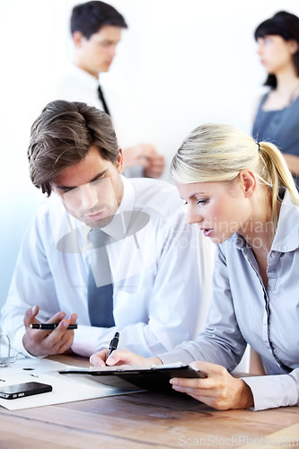 Image of Collaboration, writing or documents with a business team in a boardroom working together on a project. Teamwork, planning or strategy with men and women employees at work in the office for discussion