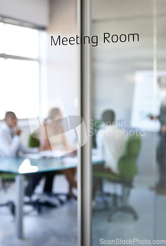 Image of Boardroom, business and team collaboration in a meeting room with company and office glass sign. Management, presentation and conference in the workplace with a workshop and teamwork planning.