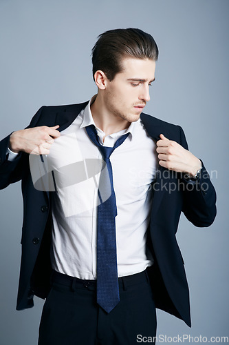 Image of Elegant, fashion and a man in a suit for business isolated on a dark background in a studio. Thinking, corporate and a businessman with style for executive, professional and career as a boss