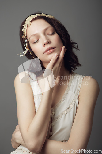 Image of Fashion, natural beauty and woman with eyes closed in studio isolated on a gray background. Beautiful, vintage clothes and female model with retro style, headband and skincare for healthy skin.