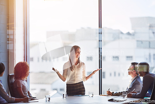 Image of Manager, talking and business people in a meeting, workshop or office training in the boardroom. Happy, corporate and diversity with employees at work for coaching, teaching or discussion with a boss