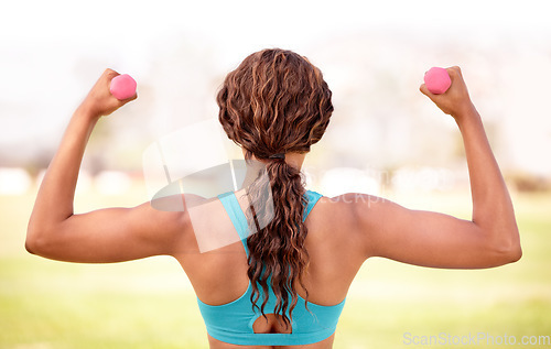 Image of Fitness, park and woman with dumbbell for exercise, body builder training and workout. Sport, weightlifting and back of female athlete with strong muscle for wellness, healthy lifestyle and wellbeing