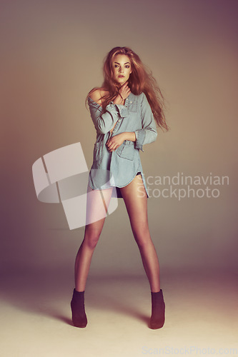 Image of Woman, modern fashion and portrait with body confidence and youth in a studio. Isolated, beautiful and young female model alone with beauty and hipster style with attitude and gen z clothes