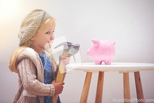 Image of Naughty, looking and a child with a hammer and piggy bank for savings, money and coins. Finance, idea and a little girl thinking of breaking a box for cash, wealth and financial growth with tools