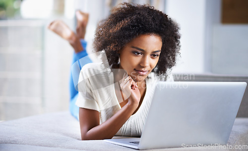 Image of Thinking, connection and woman with a laptop, online reading and ideas with social media at home. Female person, lady and model with technology, thoughts and search website with wonder and email