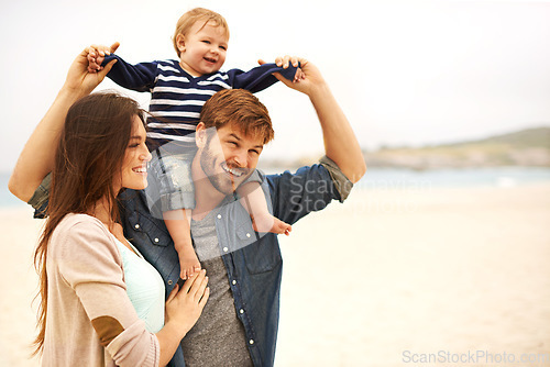 Image of Love and baby with parents at a beach for piggyback, fun and walking in nature. Family, kid and happy woman with man outdoors bonding, smile and relax while enjoying travel, freedom or game