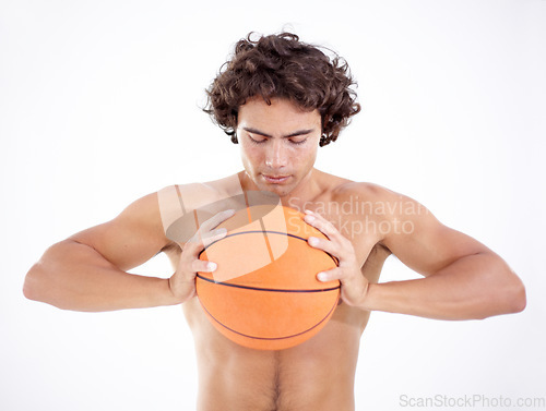 Image of Sports, squeeze and man with basketball in studio isolated on a white background. Sport, fitness and athlete holding ball, eyes closed and ready for training, exercise or workout for wellness.