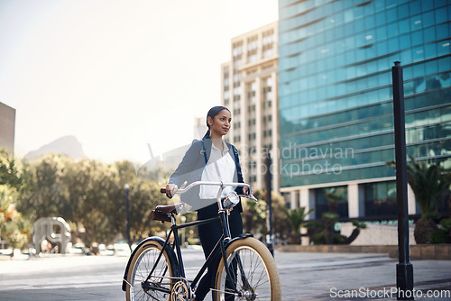 Image of Transport, walking and businesswoman with a bicycle in the city, morning and street for work routine. Eco friendly, travel and professional female employee commuting to office with bike in urban town