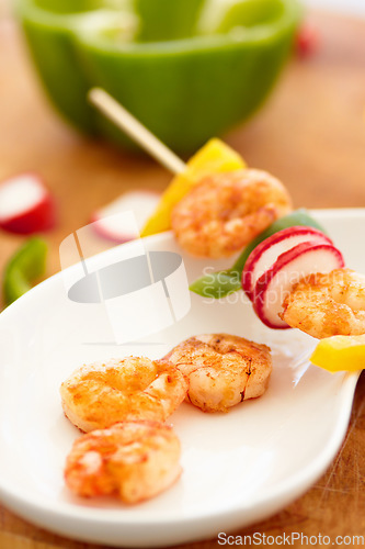 Image of Food, nutrition and prawn on a plate in a restaurant for hospitality in a luxury fine dining establishment. Shrimp, skewer and meal on a kitchen counter ready for serving in a hotel for healthy lunch