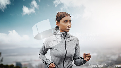 Image of Fitness, runner and Indian woman with exercise, training and focus for wellness, balance and cardio. Female person, lady and athlete outdoor, run and practice for marathon, energy and workout goal