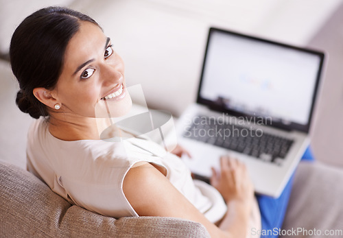 Image of Woman, laptop and portrait of sofa with smile for social media, online studying or search on web in home. Girl, computer and happiness for internet chat, research or meme on couch in living room