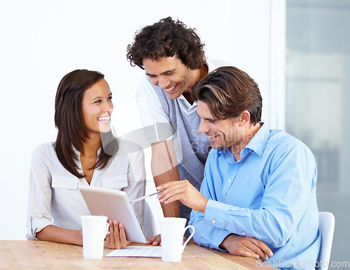 Image of Happy business people, tablet and laughing in meeting for funny joke or meme together at office desk. Group of friendly employees working on technology with laugh for social media or team building