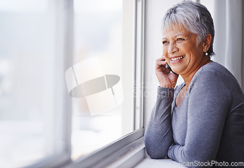 Image of Phone call, smile and elderly woman talking, speaking and chat on mobile conversation, discussion or networking. Communication, window and relax senior person talk to cellphone contact