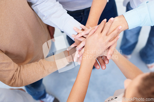 Image of Teamwork, group and hands stacked for collaboration, unity or motivation of business, community or team. People, support or solidarity or top view of joining together or goals, trust and commitment