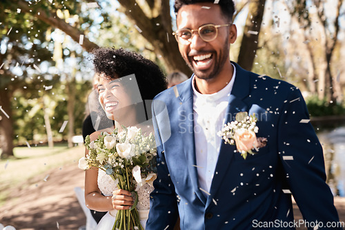 Image of Wedding day, couple and confetti outdoor with happiness and smile from marriage event. Celebration, African people and bride walking with flower bouquet at love and trust commitment ceremony