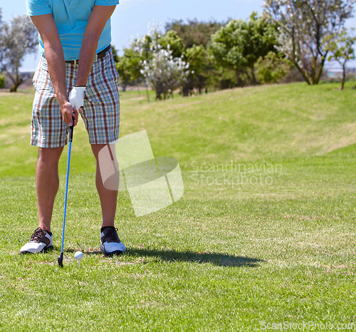 Image of Closeup, golf and man with a shot on the course, balance and fitness with a competition, health or playing. Zoom, male player or athlete on grass, golfer and match for wellness, sunshine and sports