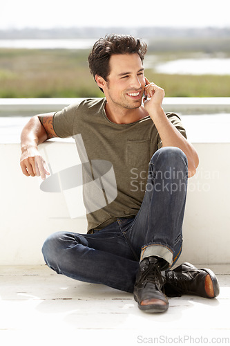 Image of Smile, phone call and man with connection, outdoor and relax with communication. Male person, network and guy with a smartphone, talking and mobile app with casual outfit, trendy clothes and talking