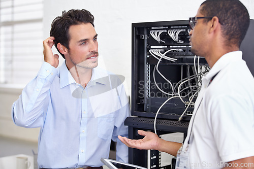 Image of Server room, it support and confused with a technician explaining to a business man about cyber security. Network, database and risk consulting with an engineer talking about information technology