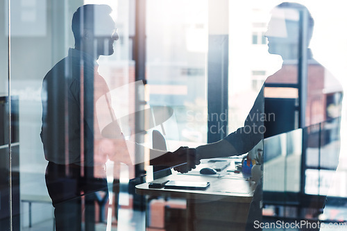 Image of Business, glass and men with handshake, collaboration and meeting with negotiation, partnership and conversation. Male employees, professional and coworkers with greeting, welcome and teamwork