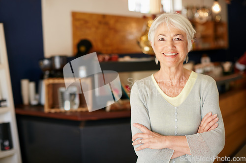 Image of Elderly, woman and portrait with crossed arms work in coffee shop for retirement for a small business. Senior female, professional and cafe for investment is working in a store for with a smile.