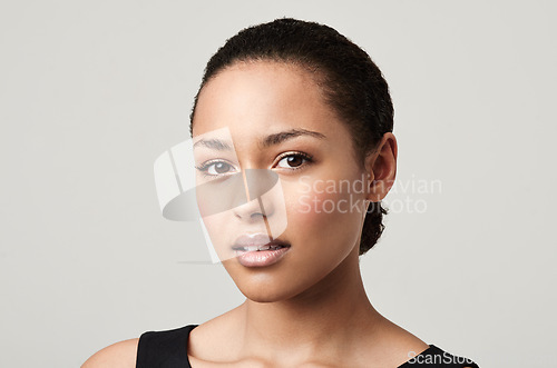 Image of Black woman, portrait and natural beauty with confidence and cosmetics in a studio feeling proud. Isolated, white background and young face of a African female person and model with makeup and pride