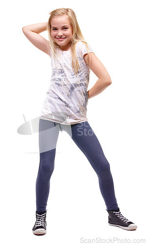 Image of Young girl, portrait and smile with fun pose for dancing and celebration with energy. White background, studio and preteen female person with a teenager model with cute and modern fashion with dance