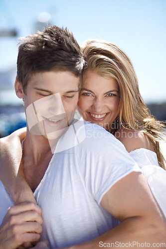 Image of Romantic, love and couple on a date together feeling happy on vacation or holiday with happiness in summer. Portrait, travel and woman hug man in a relationship and smile outdoor with care