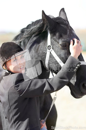 Image of Horse rider, trainer portrait and woman on equestrian training and competition ground. Outdoor, female competitor and show horses stable with a girl smile stroking an animal before riding with helmet