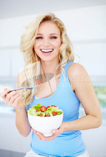 Image of Woman, portrait smile and salad bowl for healthy eating, nutrition or dieting in the kitchen at home. Happy female person smiling in happiness for vegetable diet, organic meal or natural food indoors