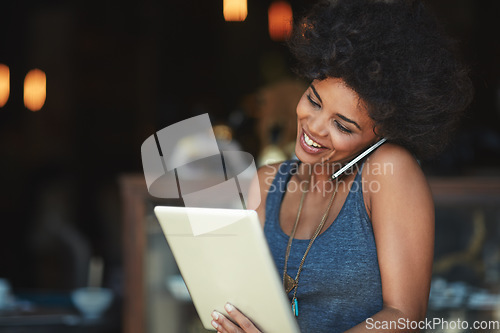 Image of Tablet, phone call and booking with a woman in a coffee shop to process an online order for takeaway. Contact, technology and communication with a black female cafe owner working in a restaurant