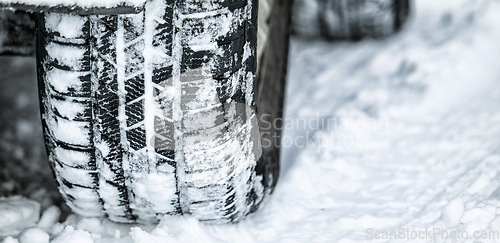 Image of Tire, winter and car driving in snow or ice for a road trip, travel and outdoor journey using transport in cold weather. Ice, transportation and vehicle drive or traveling on a track in nature