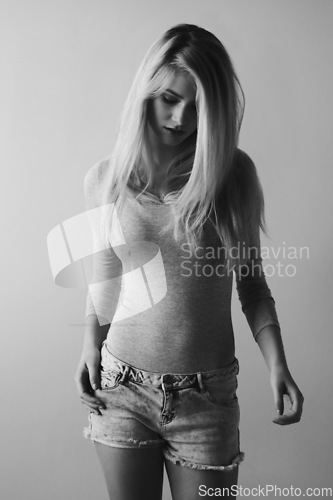 Image of Fashion, beauty and cool with woman in studio for monochrome, black and white. Trendy, glamour and edgy with female model isolated on gray background for casual, elegant and confident style