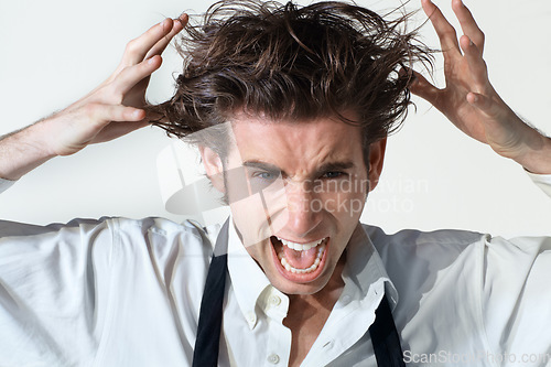 Image of Crazy, scream and portrait of business man on white background with stress, frustrated and anger. Mental health, depression and face of male worker shouting, stressed out and messy hair in studio