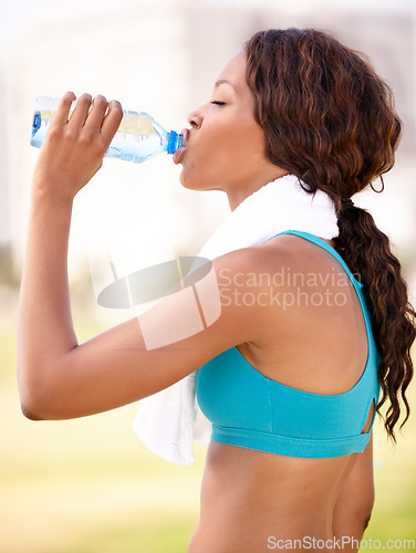 Image of Drinking water, black woman and fitness outdoor with drink after exercise and workout. Female person, profile and African athlete with bottle in nature for healthy sport training and body wellness