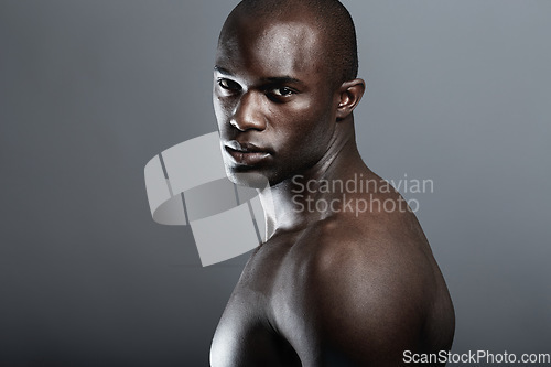 Image of Art, beauty and portrait of black man on dark background with muscle and mockup, serious body builder in Africa. Health, wellness and mock up space, African male model isolated on studio backdrop.