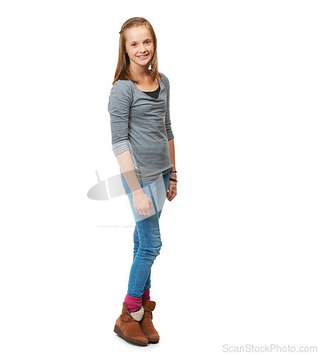 Image of Studio, full portrait and a happy teenage girl for fashion or beauty or pose and standing against a white background. Style, face and young girl smile or child model confident in jeans and shirt