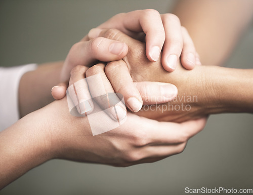 Image of Empathy, support and love with people holding hands in comfort, care or to console each other. Trust, help or healing with friends praying together during depression, anxiety or the pain of loss