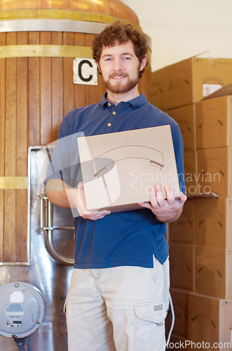 Image of Box, brewer and portrait of man with beer case after manufacturing product in a factory or distillery. Industry, happy and young male person, worker or seller smile and proud of alcohol product