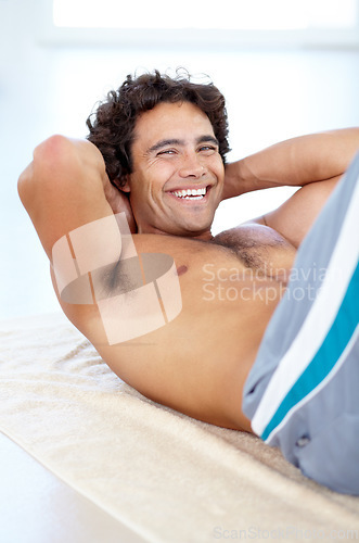 Image of Portrait, situp and man with smile in gym for health, wellness and core muscle. Training, situps and happy male person or strong athlete workout and exercise for bodybuilding, abs and sports fitness.