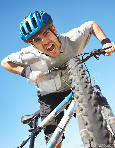 Image of Portrait, angry cyclist and crazy face with bicycle closeup on blue sky background or cycle training, outdoor workout and healthy cardio fitness. Man, agro shout or yelling about bike workout